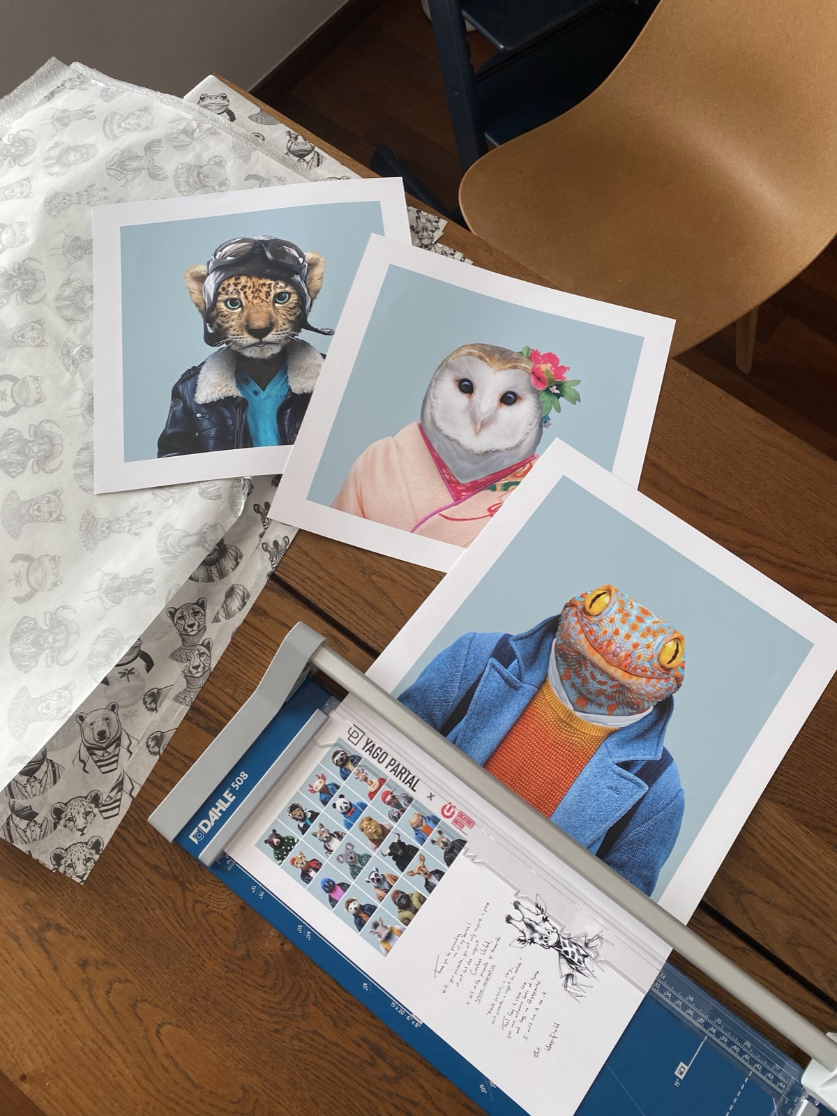 Portrait prints on the table with Dahle 508 cutter, handwritten notes and catalogue